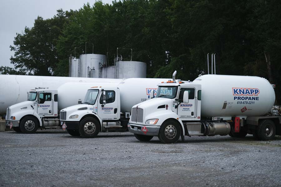 Knapp propane trucks next to large propane tank in Eldorado, Illinois