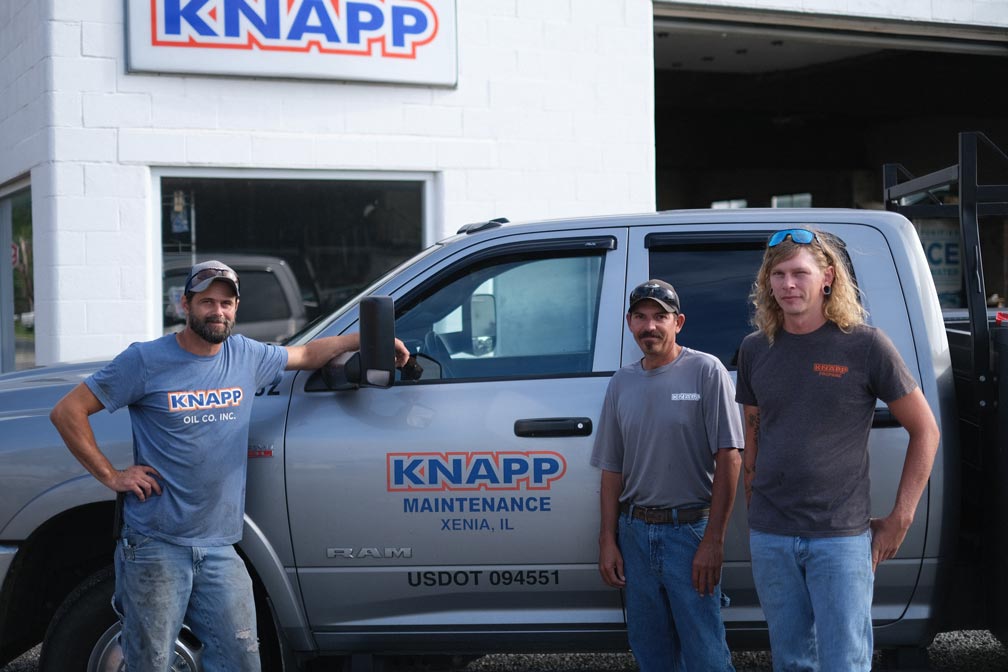 Knapp maintenance workers standing next to truck at Xenia, Illinois location