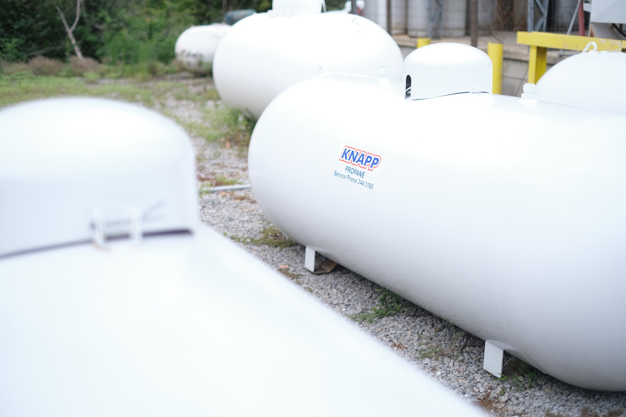 Large propane tanks shown next to a Knapp Oil facility, used on the order propane form page.